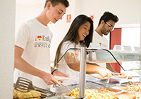 Summer camp students cooking bacon